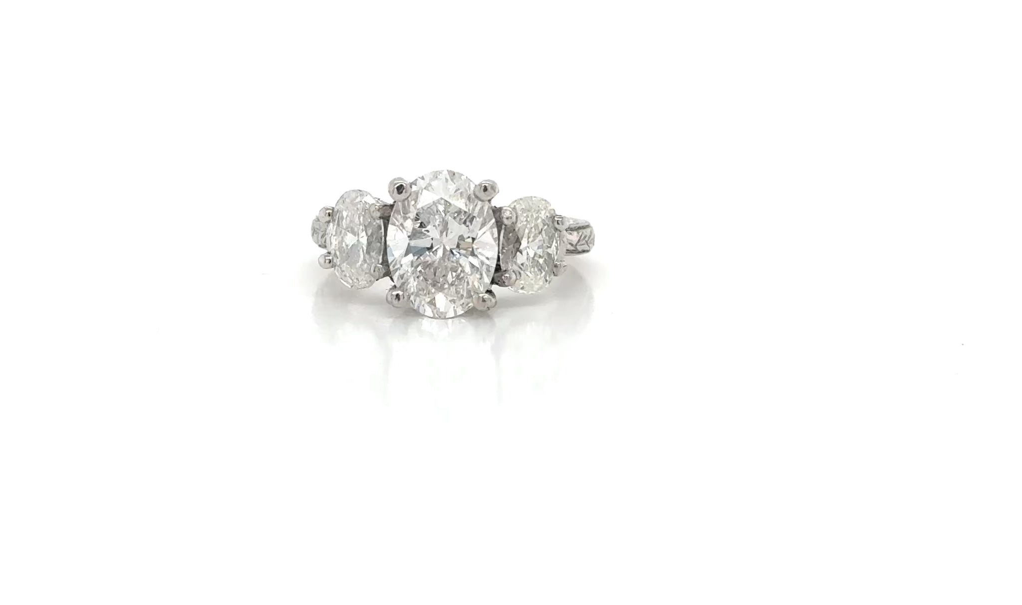 Platinum Diamond Three-Stone Ring – Engraved Band