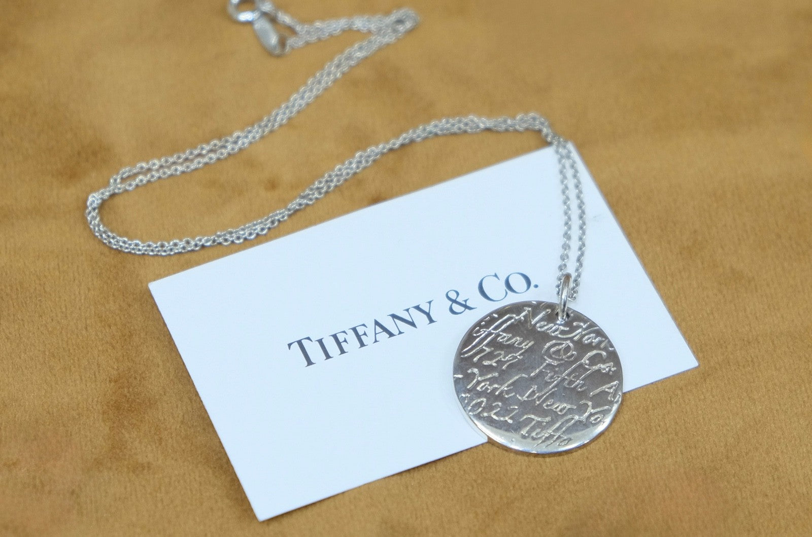 Tiffany & Co. Sterling Silver Round New York Fifth Ave Notes Pendant Necklace