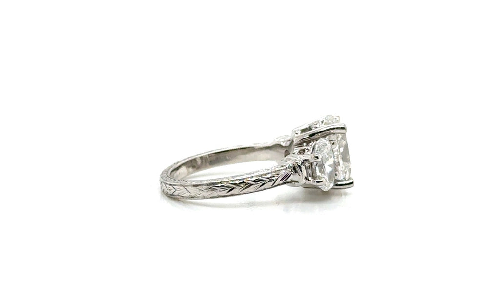 Platinum Diamond Three-Stone Ring – Engraved Band