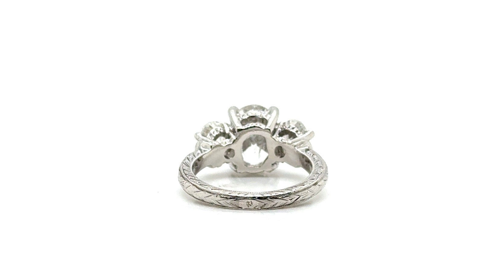 Platinum Diamond Three-Stone Ring – Engraved Band